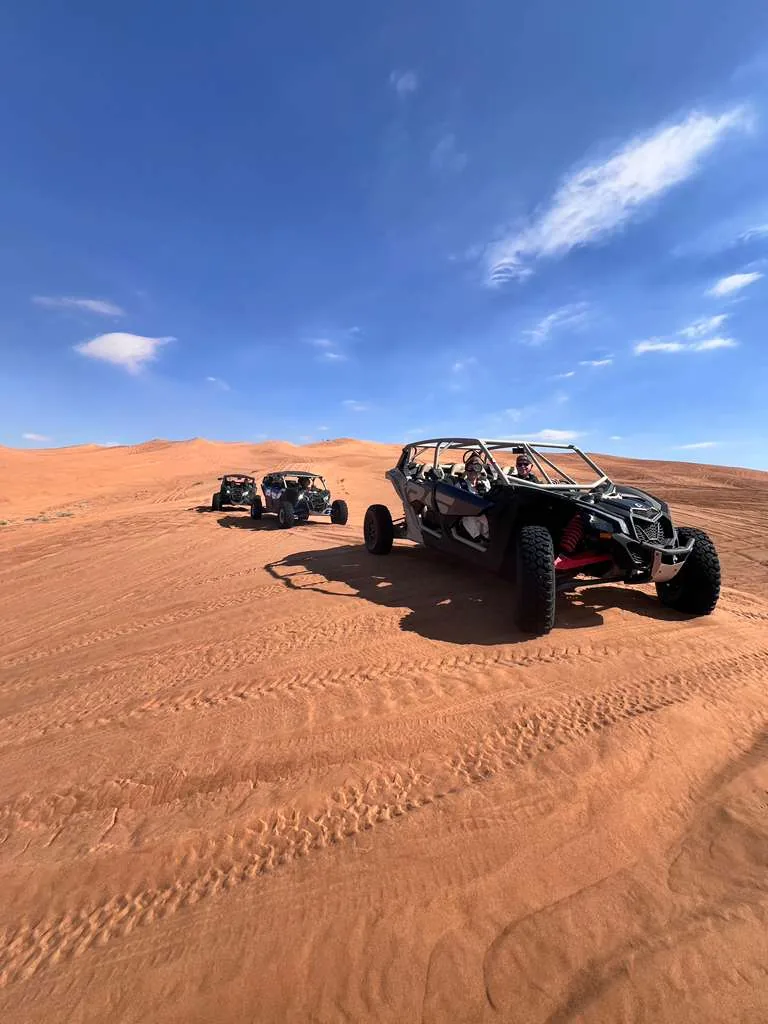 Can-Am Maverick X3 Turbo RR four-seater on open dunes