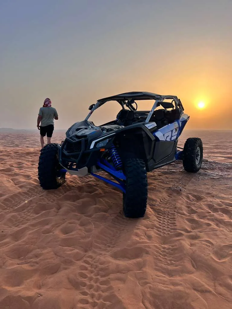 Can-Am Maverick X3 Turbo RR on the dunes at sunset